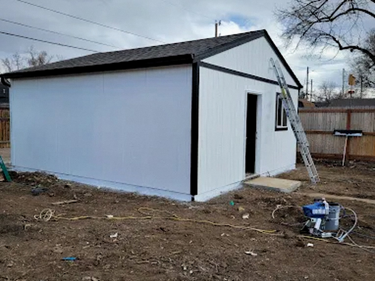 Detached backyard ADU under construction with new roof, siding and trim in Aurora, CO